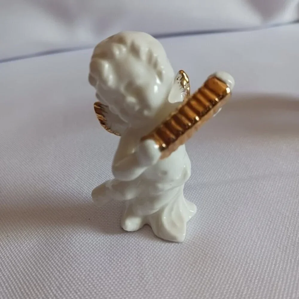 Bone china set of 4 angels gathered playing instruments
